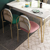 Stylish armless dining chair with shiny gold metal legs, ideal side chair for modern dining room setting